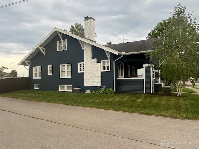 63 N Main St, West Alexandria, OH 45381 - view of side of property with a chimney
