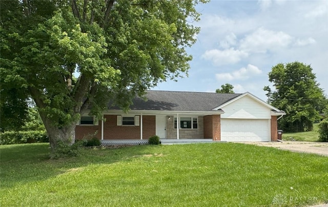 6686 Catskill Dr, Franklin, OH 45005 - ranch-style house featuring covered porch, brick siding, concrete driveway, an attached garage, and a front lawn