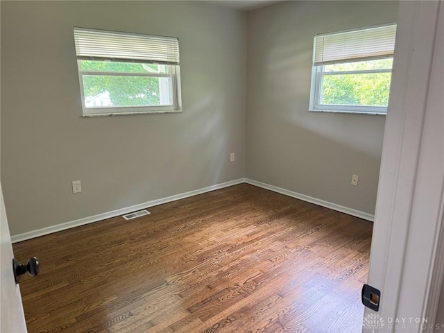 6686 Catskill Dr, Franklin, OH 45005 - empty room with plenty of natural light and wood finished floors