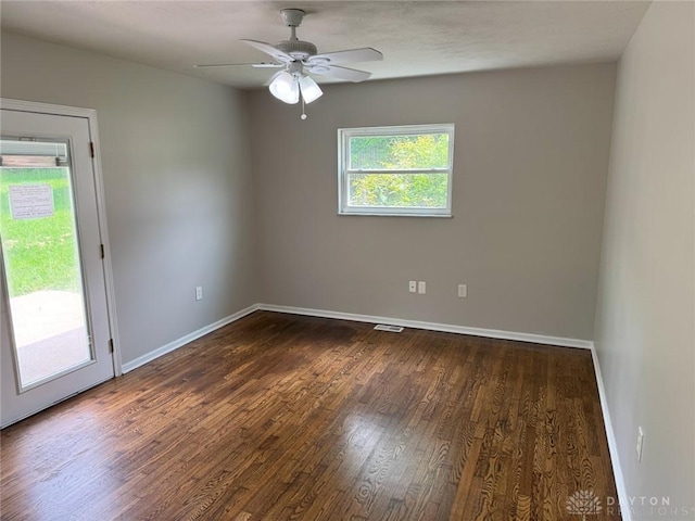 6686 Catskill Dr, Franklin, OH 45005 - unfurnished room with healthy amount of natural light, dark wood-style floors, and a ceiling fan