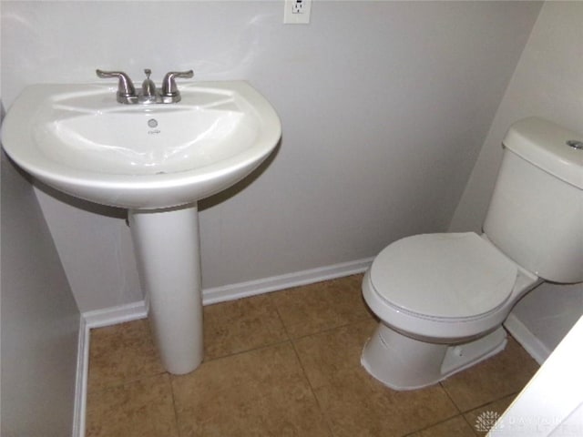 6686 Catskill Dr, Franklin, OH 45005 - half bathroom with toilet and tile patterned flooring