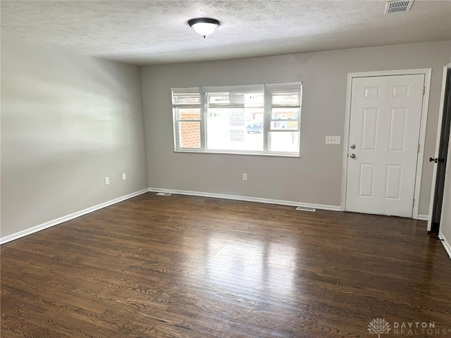 6686 Catskill Dr, Franklin, OH 45005 - spare room with dark wood-style floors and a textured ceiling