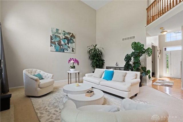 5535 Longhunter Chase Dr, Liberty Twp, OH 45044 - carpeted living room featuring a high ceiling and baseboards