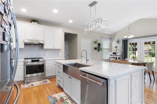 5535 Longhunter Chase Dr, Liberty Twp, OH 45044 - kitchen featuring appliances with stainless steel finishes, under cabinet range hood, light wood-style flooring, white cabinets, and recessed lighting