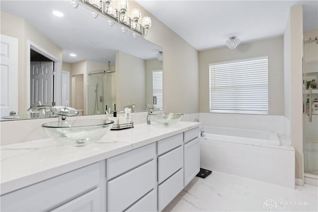 5535 Longhunter Chase Dr, Liberty Twp, OH 45044 - full bath featuring a shower stall, double vanity, a garden tub, marble finish floors, and recessed lighting
