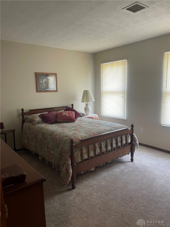 4512 Bonita Dr Unit 118, Middletown, OH 45044 - bedroom featuring carpet, multiple windows, and a textured ceiling