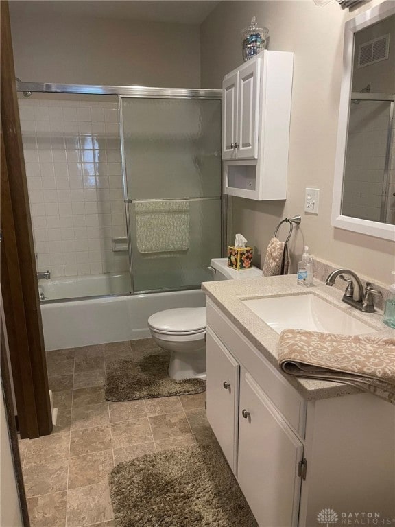 4512 Bonita Dr Unit 118, Middletown, OH 45044 - full bathroom with vanity, combined bath / shower with glass door, and stone finish floors