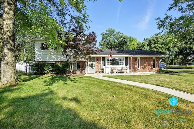 1937 Wilene Dr, Beavercreek, OH 45432 - view of front facade featuring a front yard and brick siding
