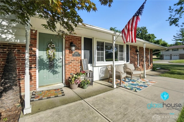 1937 Wilene Dr, Beavercreek, OH 45432 - doorway to property with brick siding and covered porch