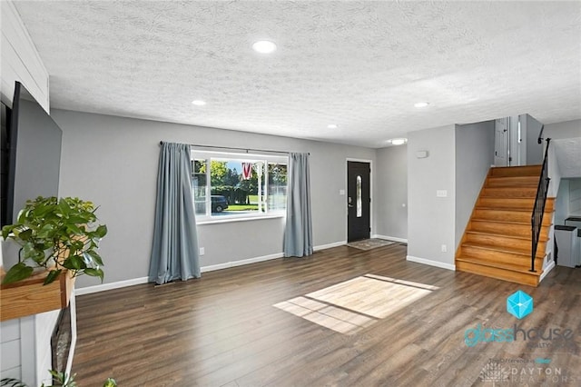 1937 Wilene Dr, Beavercreek, OH 45432 - foyer featuring wood finished floors, stairway, a textured ceiling, and recessed lighting