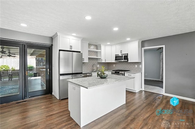 1937 Wilene Dr, Beavercreek, OH 45432 - kitchen featuring stainless steel appliances, white cabinets, dark wood finished floors, a textured ceiling, and recessed lighting