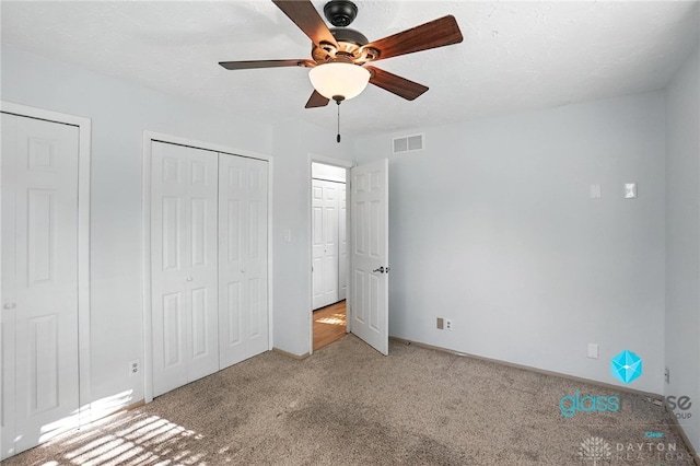 1937 Wilene Dr, Beavercreek, OH 45432 - unfurnished bedroom with carpet floors, two closets, and ceiling fan