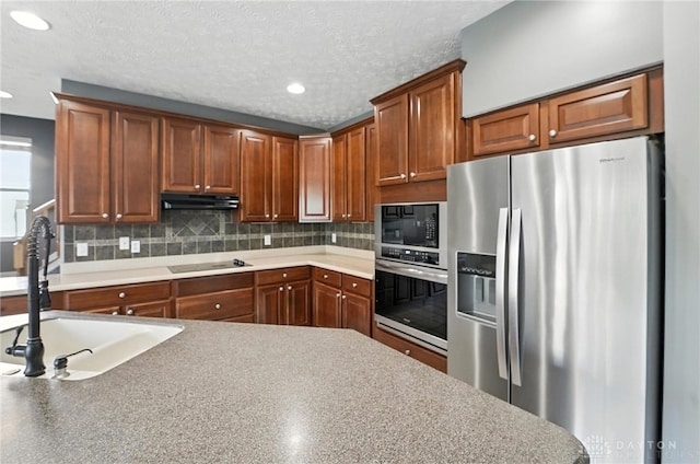4300 Turtledove Way, Miamisburg, OH 45342 - kitchen featuring black appliances, under cabinet range hood, recessed lighting, backsplash, and brown cabinetry