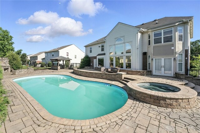 4300 Turtledove Way, Miamisburg, OH 45342 - swimming pool featuring a gazebo, a patio area, french doors, an in-ground hot tub, and a residential view