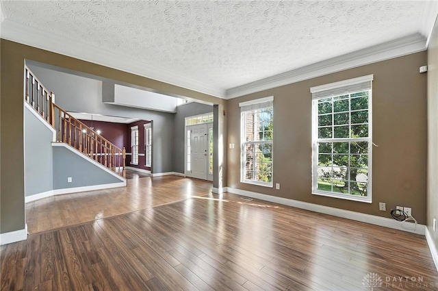 4300 Turtledove Way, Miamisburg, OH 45342 - unfurnished living room featuring stairs, wood finished floors, ornamental molding, and a textured ceiling