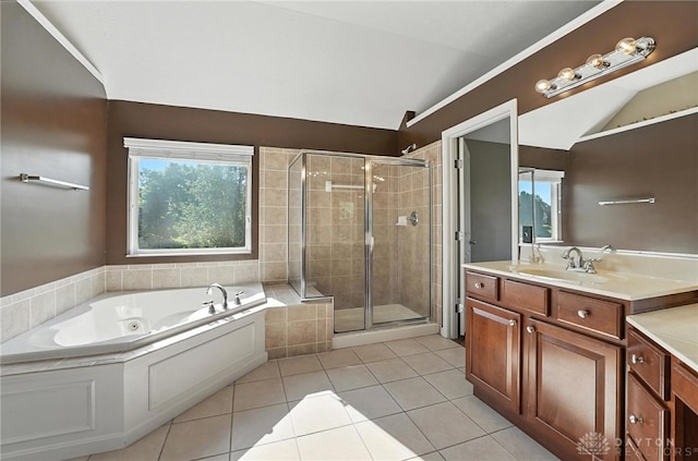 4300 Turtledove Way, Miamisburg, OH 45342 - bathroom with vanity, a tub with jets, a stall shower, vaulted ceiling, and tile patterned floors