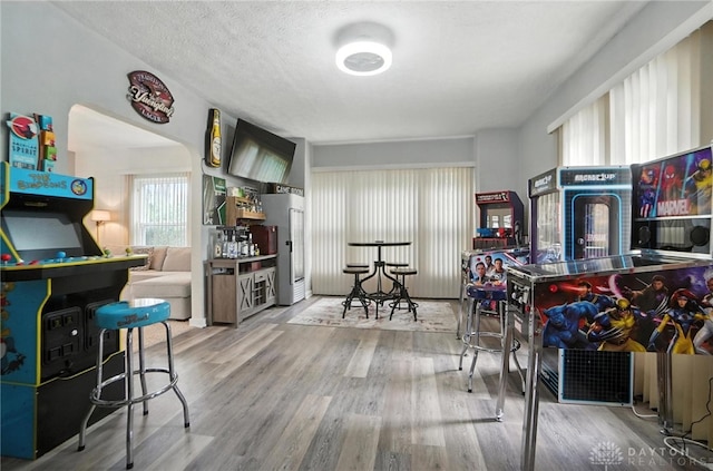 1551 W Main St, New Lebanon, OH 45345 - rec room featuring wood finished floors and a textured ceiling