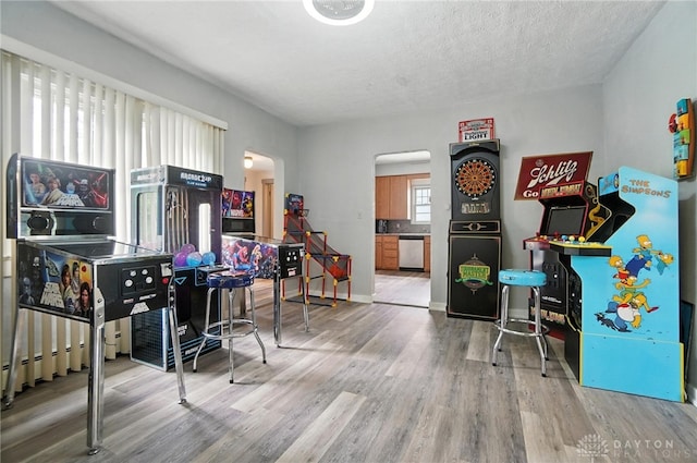 1551 W Main St, New Lebanon, OH 45345 - home office featuring wood finished floors, arched walkways, and a textured ceiling