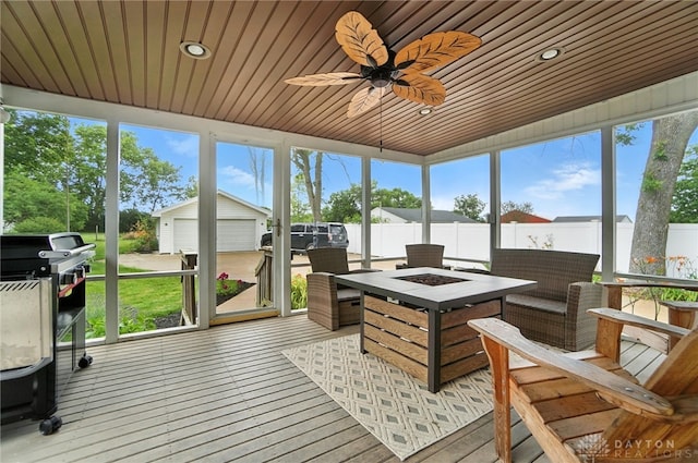 1551 W Main St, New Lebanon, OH 45345 - sunroom featuring an outdoor fire pit, ceiling fan, and healthy amount of natural light