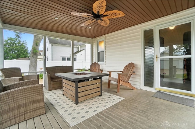 1551 W Main St, New Lebanon, OH 45345 - deck with a ceiling fan and an outdoor living space with a fire pit