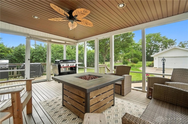 1551 W Main St, New Lebanon, OH 45345 - sunroom / solarium with an outdoor fire pit, ceiling fan, and healthy amount of natural light