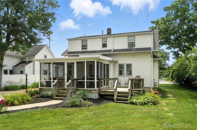 1551 W Main St, New Lebanon, OH 45345 - rear view of property featuring a sunroom, a shingled roof, a chimney, and a wooden deck