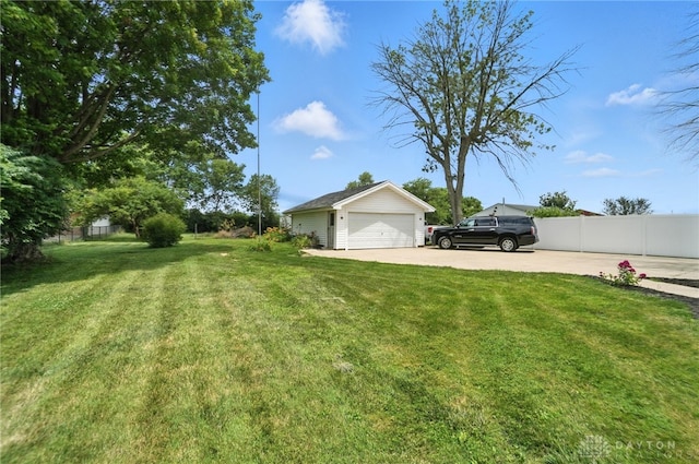 1551 W Main St, New Lebanon, OH 45345 - view of yard with an outdoor structure and a garage