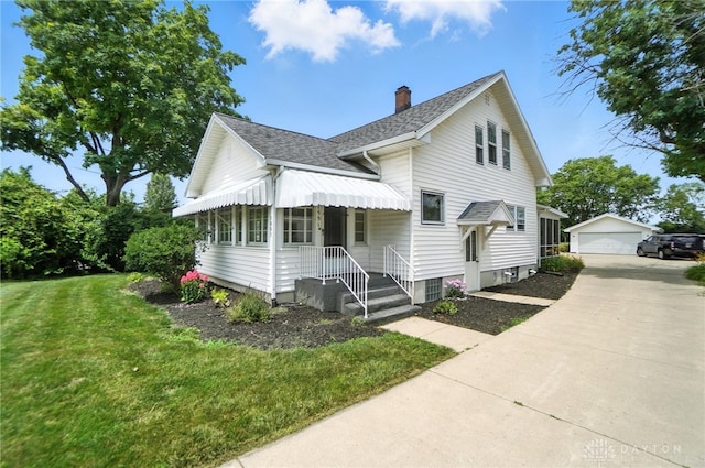 1551 W Main St, New Lebanon, OH 45345 - view of front of home featuring an outbuilding, a front lawn, a chimney, a garage, and roof with shingles