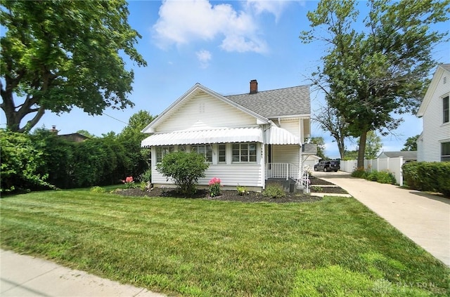 1551 W Main St, New Lebanon, OH 45345 - view of front of home featuring driveway, roof with shingles, and a chimney