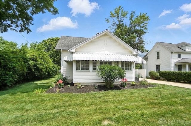 1551 W Main St, New Lebanon, OH 45345 - view of front of house with a front lawn