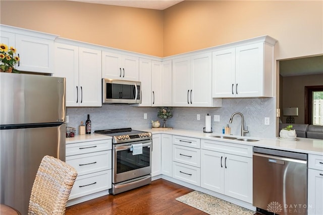 100 Timberwind Ln, Vandalia, OH 45377 - kitchen with stainless steel appliances, light countertops, decorative backsplash, and white cabinets