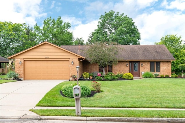 100 Timberwind Ln, Vandalia, OH 45377 - single story home featuring a garage, concrete driveway, brick siding, and a front yard