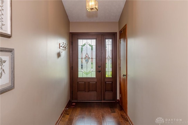 100 Timberwind Ln, Vandalia, OH 45377 - doorway with dark wood-style flooring and baseboards