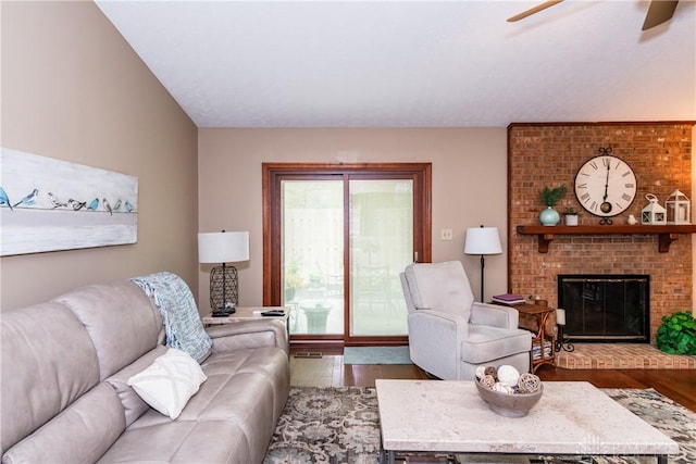 100 Timberwind Ln, Vandalia, OH 45377 - living room featuring wood finished floors, ceiling fan, and a brick fireplace