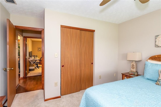 100 Timberwind Ln, Vandalia, OH 45377 - bedroom with a closet, carpet flooring, ceiling fan, and a textured ceiling