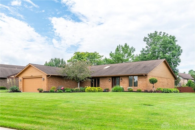 100 Timberwind Ln, Vandalia, OH 45377 - single story home featuring brick siding, a garage, and a front yard