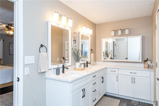 100 Timberwind Ln, Vandalia, OH 45377 - bathroom featuring ensuite bathroom, a ceiling fan, and double vanity