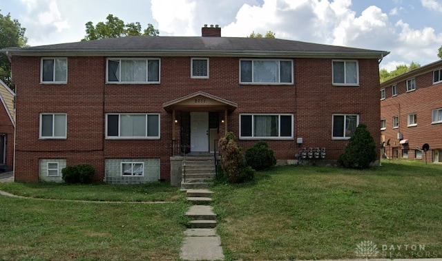 2011 Riverside Dr, Dayton, OH 45405 - view of front of property featuring a front yard, brick siding, and a chimney