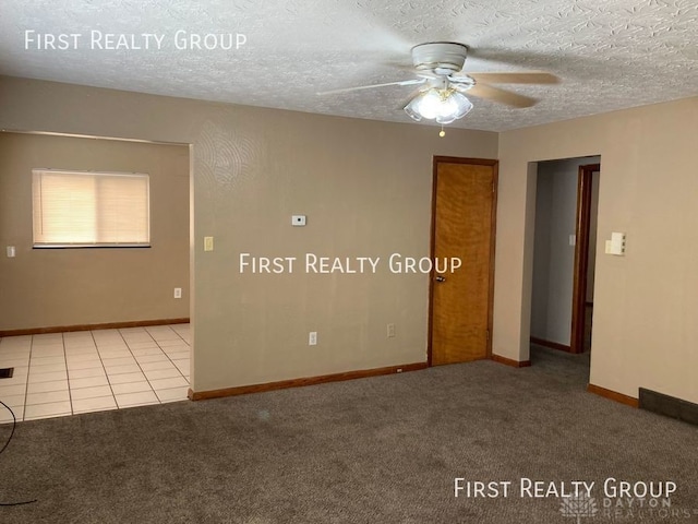 2011 Riverside Dr, Dayton, OH 45405 - carpeted empty room featuring a ceiling fan and a textured ceiling