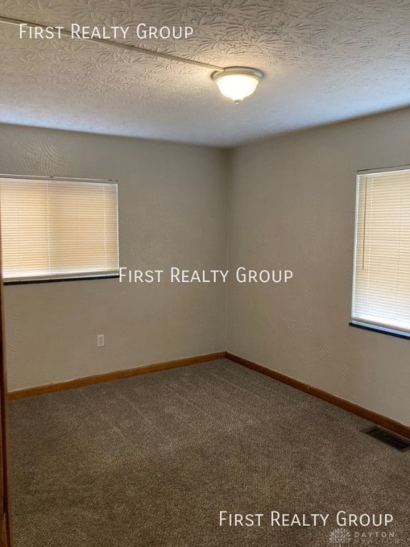 2011 Riverside Dr, Dayton, OH 45405 - carpeted empty room with baseboards