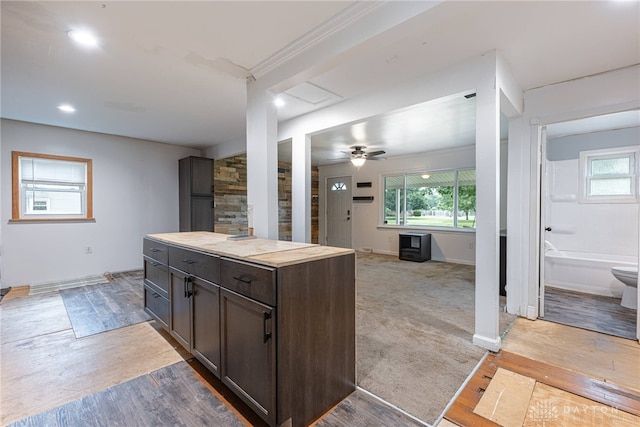 359 Gladys Ave, Franklin, OH 45005 - kitchen with dark brown cabinetry, healthy amount of natural light, wooden counters, light wood-style flooring, and recessed lighting