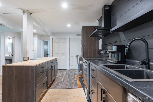 359 Gladys Ave, Franklin, OH 45005 - kitchen featuring wall chimney exhaust hood, crown molding, wood finished floors, stainless steel range with electric stovetop, and wooden counters