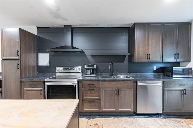 359 Gladys Ave, Franklin, OH 45005 - kitchen featuring stainless steel appliances, wall chimney exhaust hood, and dark countertops