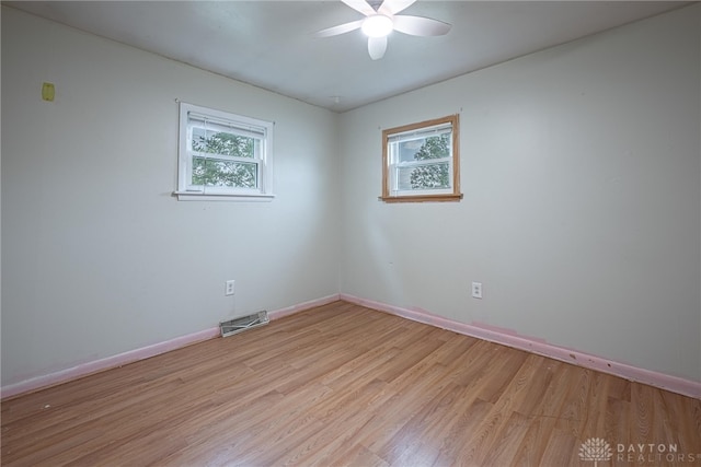 359 Gladys Ave, Franklin, OH 45005 - unfurnished room with healthy amount of natural light, light wood finished floors, and a ceiling fan