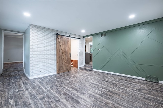 359 Gladys Ave, Franklin, OH 45005 - empty room with wood finished floors, a barn door, and recessed lighting