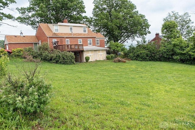 557 W N Bend Rd, Springfield Twp, OH 45224 - view of grassy yard with a deck