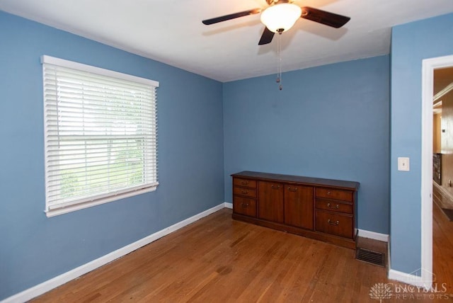 557 W N Bend Rd, Springfield Twp, OH 45224 - unfurnished bedroom featuring wood finished floors and ceiling fan