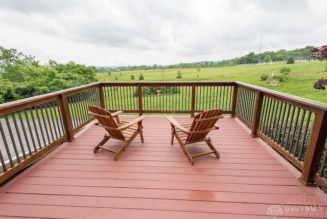 557 W N Bend Rd, Springfield Twp, OH 45224 - wooden terrace with a view of countryside and a lawn