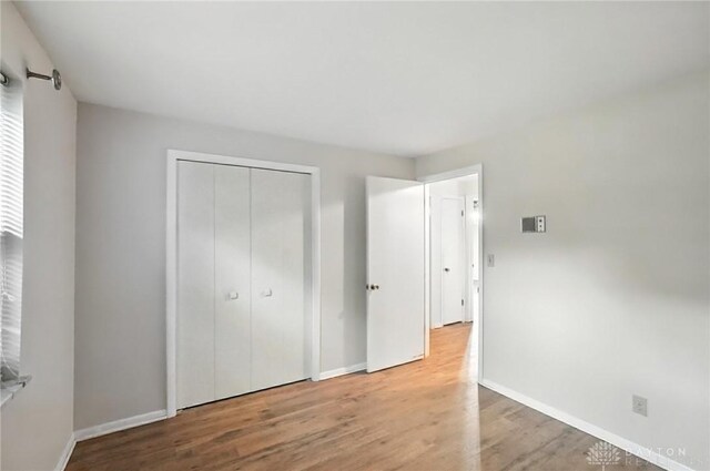 2184 Broadbent Way, Dayton, OH 45440 - unfurnished bedroom featuring wood finished floors and a closet
