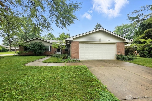 2184 Broadbent Way, Dayton, OH 45440 - single story home with brick siding, a garage, driveway, and a front yard